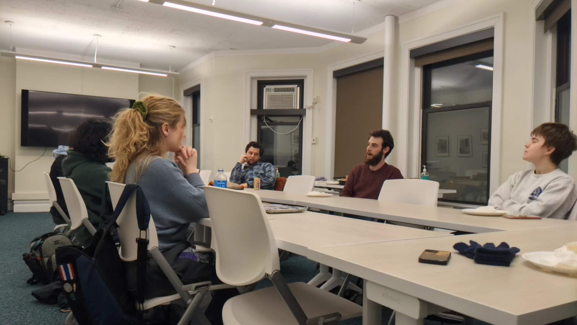 Students sitting
                        around the table at Future Café event